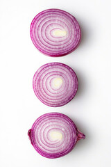 Wall Mural - Vertical Fresh whole and sliced red onion isolated on white background, top view.