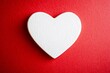 © masud - White Heart on Red Background: A Symbol of Love and Affection