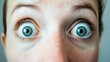 © Lakkhana - A person's face reflecting surprise, with wide eyes and an open mouth, as a universal basic emotion
