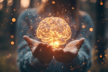 a glowing brain surrounded by particles held in open hands against a blurred forest background