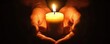 © AIsofeel - Hands holding a glowing candle in dark, symbolizing warmth and hope.