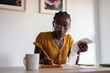 © Milles Studio/Stocksy - Woman counting expenditure