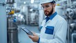 © Noppakun - Engineer Using Digital Tablet in Industrial Setting