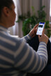 © Oleksii Syrotkin/Stocksy - Woman checking credit card balance on mobile banking application