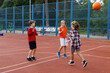 © Oleksii Syrotkin/Stocksy - Boys high-fiving their friend after successful free throw during game