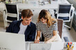© BONNINSTUDIO/Stocksy - Colleagues working together on laptop in office