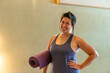 © Christine La/Stocksy - Happy portrait exercise mat