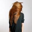 © Rene de Haan/Stocksy - redhead waving her hair