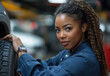 © Professional Agency - Confident female mechanic working on a car in a garage setting