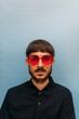 © Pati Gagarin/Stocksy - Portrait of a young man with blue background