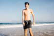 © Adrian Rodd/Stocksy - Teenager enjoys a summer day soaking in the ocean waves at the beach