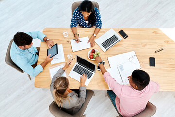 Poster - Business people, technology or planning above with documents on wooden table for brainstorming at office. Top view, creative designers or employees with paperwork for project ideas or meeting on desk