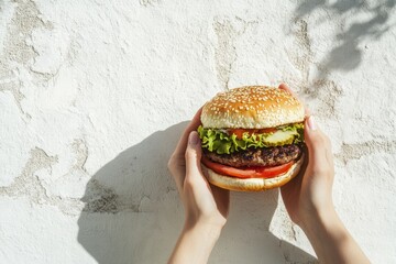 Poster - Two hands proudly grip a sizable burger filled with lettuce, tomato, and a juicy patty, showcasing a delicious meal against a neutral backdrop. Generative AI