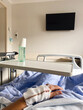 © Mal de Ojo Studio/Stocksy - Hospital Room with Recovering Patient