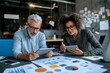 © Odin AI - A man and woman sit together in a sleek office, using tablets to discuss data and charts, representing teamwork and strategic communication.