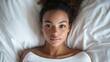 © Hailie - Portrait of a Young Woman Resting on Soft Bedding