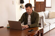 © Wavebreak Media - senior man working on laptop at home, focusing on task