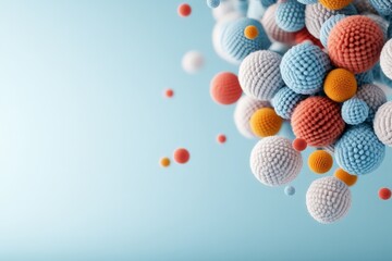 Poster - This image displays a cluster of colorful yarn balls in white, orange, and blue, set against a soft blue background, creating a cozy and artistic ambiance.
