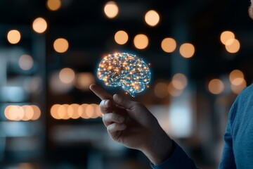 Poster - A hand points at a glowing digital brain, symbolizing human interaction with AI, set against a soft-focus background with bokeh lighting effects.