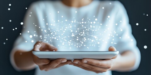 Poster - Close-up of hands holding a tablet revealing a digital network, symbolizing the global connections that technology facilitates in the digital age of today.