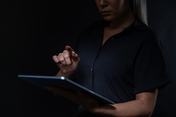 Poster - Woman hand and finger touch something holding tablet
