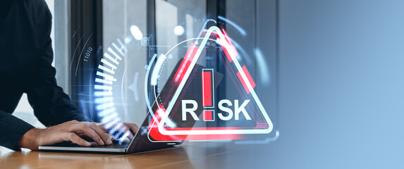 Poster - Businessman using laptop with digital risk management icon hologram.