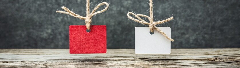 Poster - Two price tags showing different amounts for similar products placed side by side, emphasizing value and price comparison with clear space for text.