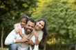 © Photographielove - portrait of indian family outdoor candid moment, Joyful Family Piggyback Ride in Nature