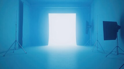 A blue-lit studio space with a bright white doorway and photography equipment.