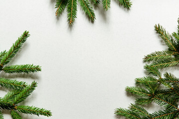 Wall Mural - christmas card with christmas tree branches. light background. mockup. happy new year frame.