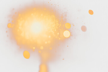Aufkleber - Abstract bokeh lights with warm yellow and orange glow against a dark background.