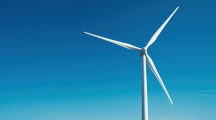 A solitary wind turbine against a clear blue sky, symbolizing renewable energy and sustainable practices.