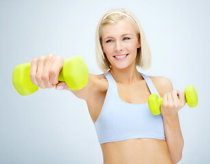 Fitness, thinking and woman with dumbbell in studio for exercise challenge, training and healthy body. Happy, athlete and person with gym equipment for muscle, workout or strength by white background