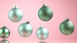 © Anton - Floating teal Christmas baubles with pink background