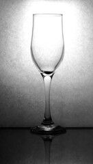 empty wine glass close up. black and white vertical photo.