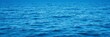 © PuriStudio - A serene ocean background with clear blue water, gently rolling waves, and a distant horizon under a clear blue sky, sea, scenery