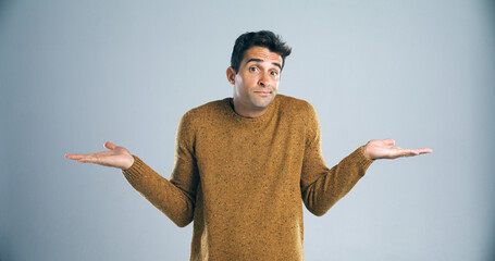 Aufkleber - Man, portrait and unsure with hands in studio for question, confused or doubt with decision on mockup space. Person, choice or scale for options with comparison, shrug or uncertain on gray background