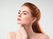 © thiquynh - Beautiful woman with clean and healthy skin touching her neck on a white background, a body care concept.