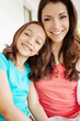 © GR/peopleimages.com - Family, love and portrait of mother with daughter for development, growth or relationship. Face, happy or smile with single parent woman and girl child together for safety, security or trust