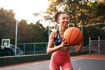 Woman, sport and ball on basketball court as athlete or player for challenge as ready for training. Female person, warm up and outdoor for competition, match and game in physical activity or exercise