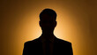 © mahamad - A silhouette portrait of a businessman with a mysterious expression, focusing on intrigue and professionalism.