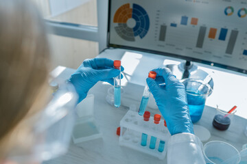 Aufkleber - A skilled scientist in a lab conducts complex tests with specialized tubes and advanced methods, resulting in groundbreaking discoveries and significant advancements in research and technology