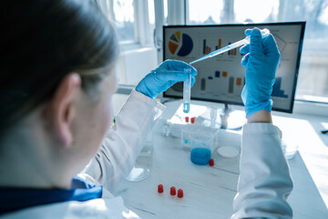 Aufkleber - A scientist meticulously conducting a variety of innovative experiments in a highly modern and wellequipped laboratory setting, focused on advancing research in the fields of biology and chemistry