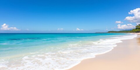 Sandy beach with crystal clear blue water under a bright sunny sky, horizon, beach