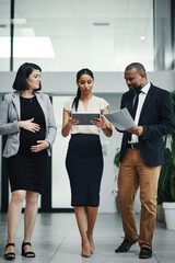 Pregnant, woman and discussion with documents, office and communication for proposal, review and smile. Collaboration, listening and expecting parent with colleagues, corporate people and paperwork