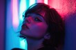 © Alexandr Efimov - A young woman with makeup, enjoying the vivid night scene. Red and blue neon lights. Cool urban atmosphere.