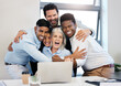 © peopleimages.com - Business people, celebration and hug by laptop with stock market growth, success and excited from win. Deal, trading and finance investment with profit, promotion and good news with tech and teamwork