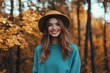 © DnQajik - Woman in a teal sweatshirt and hat, a mockup template for an autumn