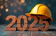© Olga - A yellow construction helmet rests on the brick-red numbers 2025, New Year's Eve background