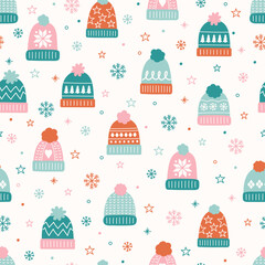 Wall Mural - colourful seamless pattern with winter hats in cartoon style. vector illustration